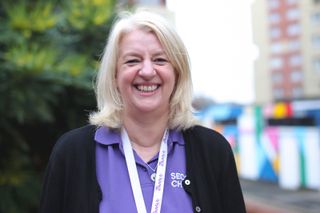 Second Chance staff member smiling at the camera.